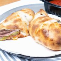 Stromboli · Pepperoni, sausage, ham, mushroom, onion, green pepper, tomato sauce, and cheese wrapped in ...
