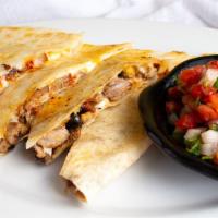 Chilanga · Flour tortilla only. With melted cheese, steak and seasoned pork with guajillo. Served with ...
