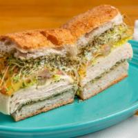 Chicken Pesto  · Succulent chicken with pesto sauce on toasted focaccia bread. with bacon, mixed greens, toma...
