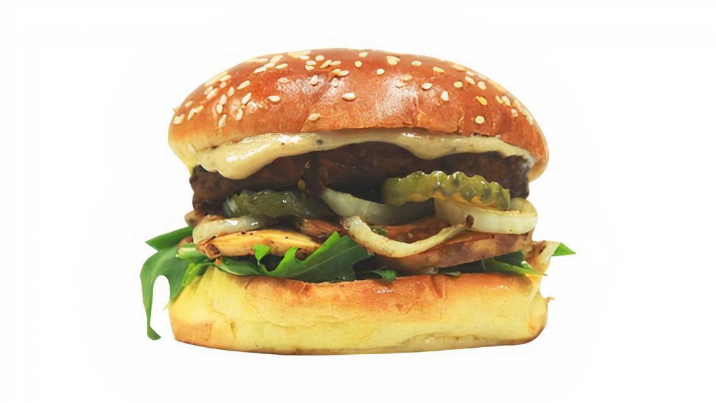 Black Bean Burger · Black bean patty, vegan cheese sauce, grilled onions, grilled mushroom, arugula, pickle, 1000 island dressing. Served on sesame buns.
For Gluten-Free, replace buns with lettuce