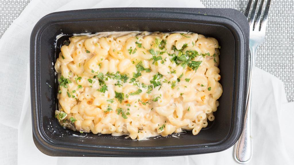 Mac & Cheese · Three-cheese sauce and buttered bread crumbs.