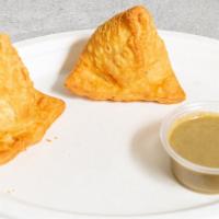 Samosa (2) · Two Samosas. Its made up of maida flour, vegetable oil or butter, salt, and water.