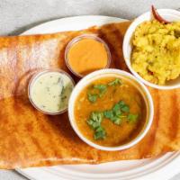 Andhra Kara Masala Dosa · A thin golden crispy rice and lentil flour crepe layered with special Andhra spicy chutney, ...