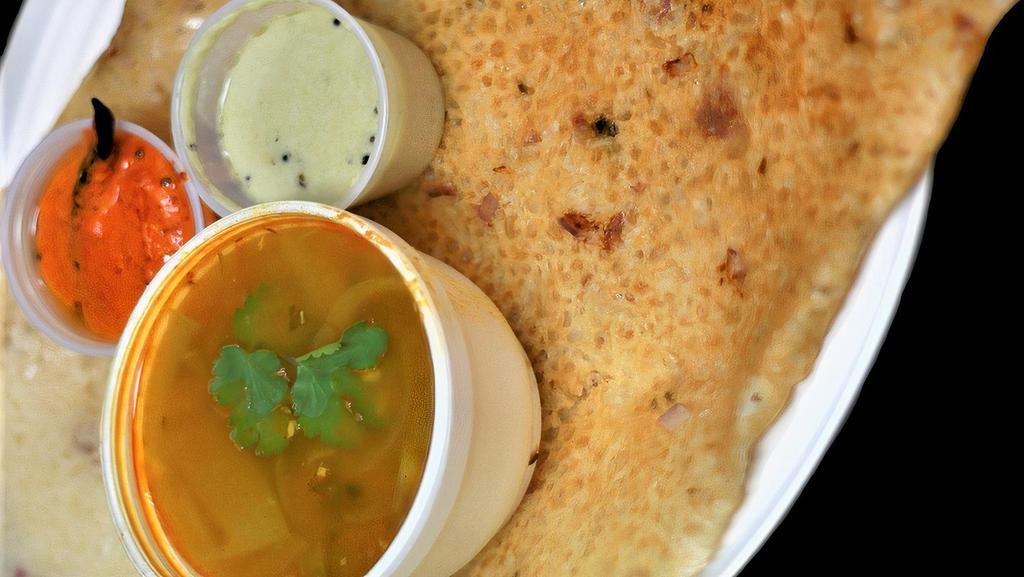 Onion Rava Masala · It is made of sooji, rice flour, and water or buttermilk. The batter is spiced with onions. Stuffed with mashed potato masala. Served with  Sambar & Chutney