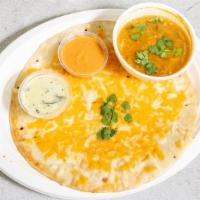 Cheese Uthappam · Rice and white lentil flour pancake topped with Cheese served with sambar and chutneys.