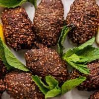 Kibbe Platter · Pita bread, two kibbe, tabbouleh, hummus.