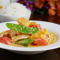 Red Curry Chicken · Bell pepper, onion, snow peas, tomato and pineapple in a rich and spicy red curry sauce.