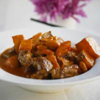 Massaman Beef · Beef chunk, potato and peanut in a rich and mild spicy massaman sauce.