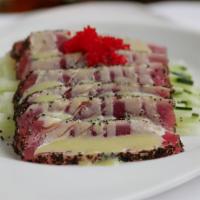 Tuna Cappaccio · Sliced black pepper tuna with House made honey wasabi sauce.