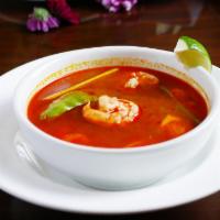 Tom Yam Goon · Famous thai hot and sour soup with coconut cream, lemongrass, shrimps, snow peas, tomato and...