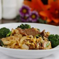 Drunken Noodle · Fresh made broad rice noodles, egg, red onion, scallion, broccoli & basil stir-fried with a ...