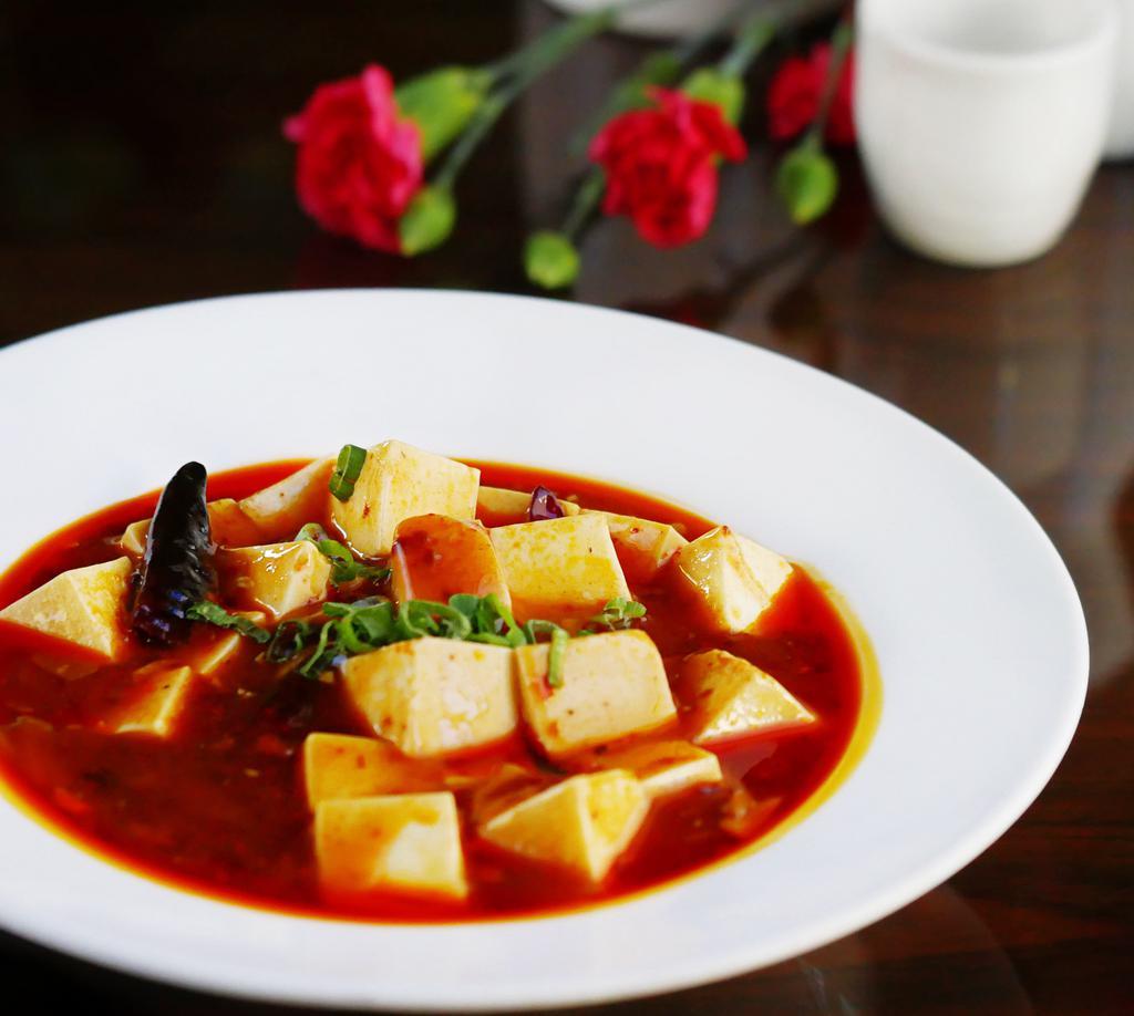 Ma Po Tofu · Soft tofu cubes in a szechuan style hot and spicy sauce.