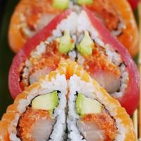 Sweet Heart Roll · Spicy tuna, yellowtail, avocado and tempura crunch rolled in nori seaweed, topped with tuna ...