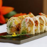 Lion Roll (10 Pc) · Soft shell crab, shrimp tempura, avocado, cucumber and crab salad wrapped in sesame soy pape...