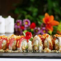 Beauty & The Beast Roll · Inside: shrimp tempura, cream cheese and avocado, outside:tuna, eel, tempura crumbs and tobi...