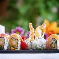Dynamite Roll · Inside: tempura shrimp, avocado and cucumber, outside: tuna, salmon and yellowtail, sauce: s...