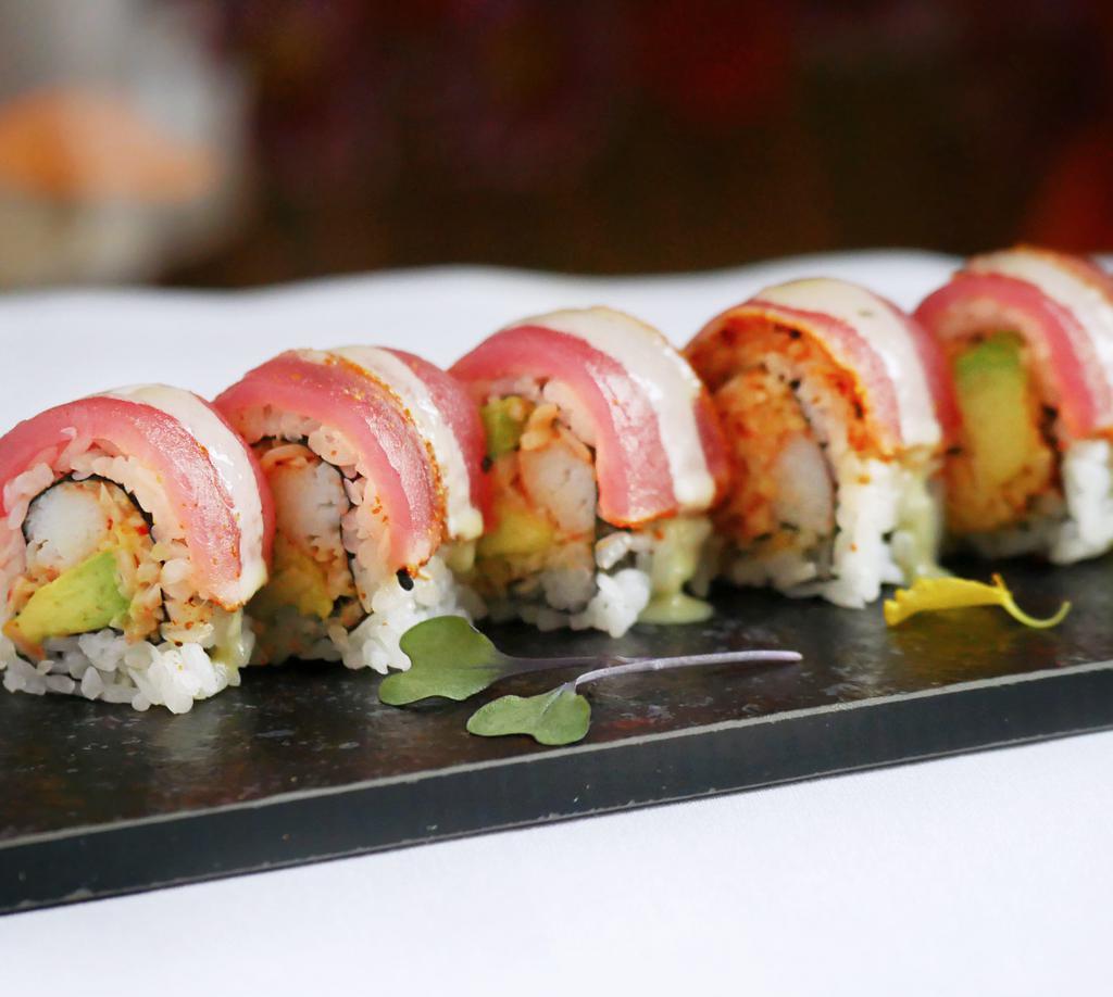 Bonsai Roll · Spicy crab and avocado inside, black pepper tuna and honey wasabi sauce on top.