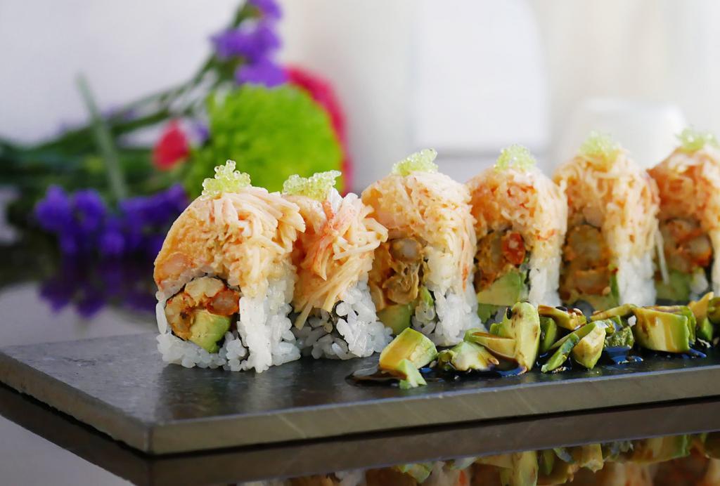 New Orleans Roll · Inside: spicy crawfish and avocado outside: lobster salad, spicy crab and tobiko served with Avocado eel sauce.