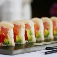 Snow White Roll · Tuna, salmon, yellowtail and avocado rolled in white soy paper, topped with white tuna and y...