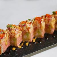 Pink Lady Roll · Shrimp tempura, avocado, cucumber and spicy tuna wrapped in pink soy paper, topped with spic...