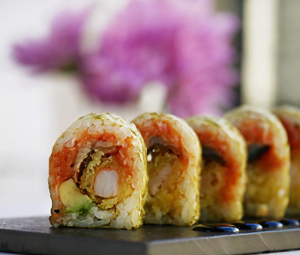 Viper Roll · Eel, avocado, tempura shrimp and spicy tuna wrapped with Marble seaweed, topped with Eel sauce.