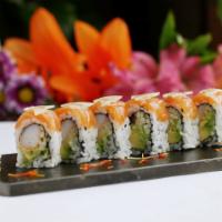 American Dream Roll · Crab stick, avocado and cucumber topped with salmon, thinly sliced lemon and ginger sauce.
