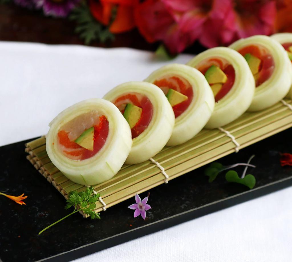 Naruto Roll (No Rice) · Yellowtail, salmon, tuna, avocado, masago and scallion wrapped with thin cucumber shell, served with Ponzu sauce.