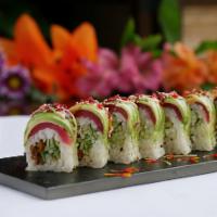 Spiderman Roll · Soft shell crab and cucumber in sesame soy paper, topped with tuna, avocado, red tobiko, sca...