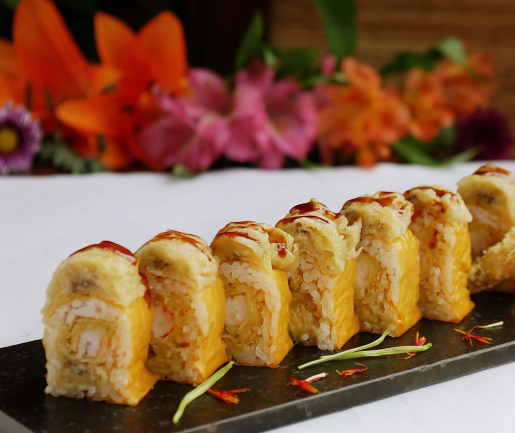 Banana Roll · Tempura shrimp and banana wrapped in soy paper, topped with tempura banana and eel sacue.