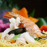 Seafood Pan Fried Noodle · Shrimp scallop mussel lobster tail &seasonal veg. cooked a delightful white wine sauce serve...