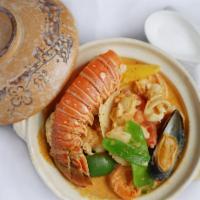 Thai Curry Seafood In Clay Pot · Shrimp, scallop, mussel and lobster with mixed vegetables in a rich and creamy scrumptious c...