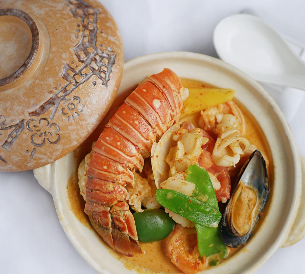 Thai Curry Seafood In Clay Pot · Shrimp, scallop, mussel and lobster with mixed vegetables in a rich and creamy scrumptious curry sauce.
