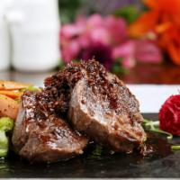 Filet Mignon With Xo Sauce · Filet mignon seared to perfection, served with Asian vegetables and xo sauce (a spicy seafoo...