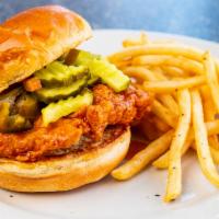 Nashville Hot & Spicy Chicken Sandwich · A marinated chicken breast, breaded and fried, tossed in a spicy honey sauce served on a rol...