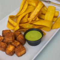 Queso Frito · Fried cheese cubes with fried green plantain chips and homemade cilantro sauce.