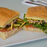 Sarussi Tuna Sandwich · Tuna prepared with mayonnaise, onions, tomatoes, potato sticks, lettuce, and house sauce.