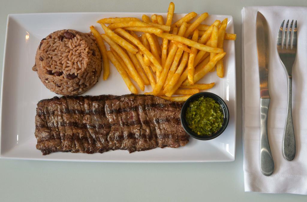 Churrasco Platter · Grilled skirt steak marinated with chimichurri sauce accompanied with two side dishes.
