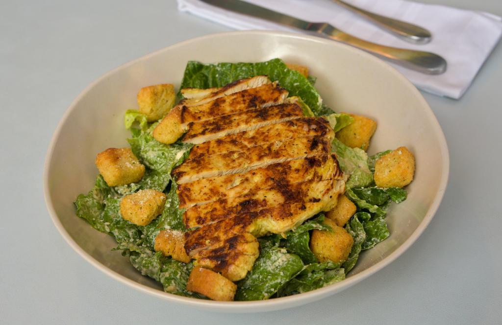 Chicken Caesar Salad · Grilled chicken breast, Romaine lettuce, croutons, parmesan cheese, and caesar dressing.