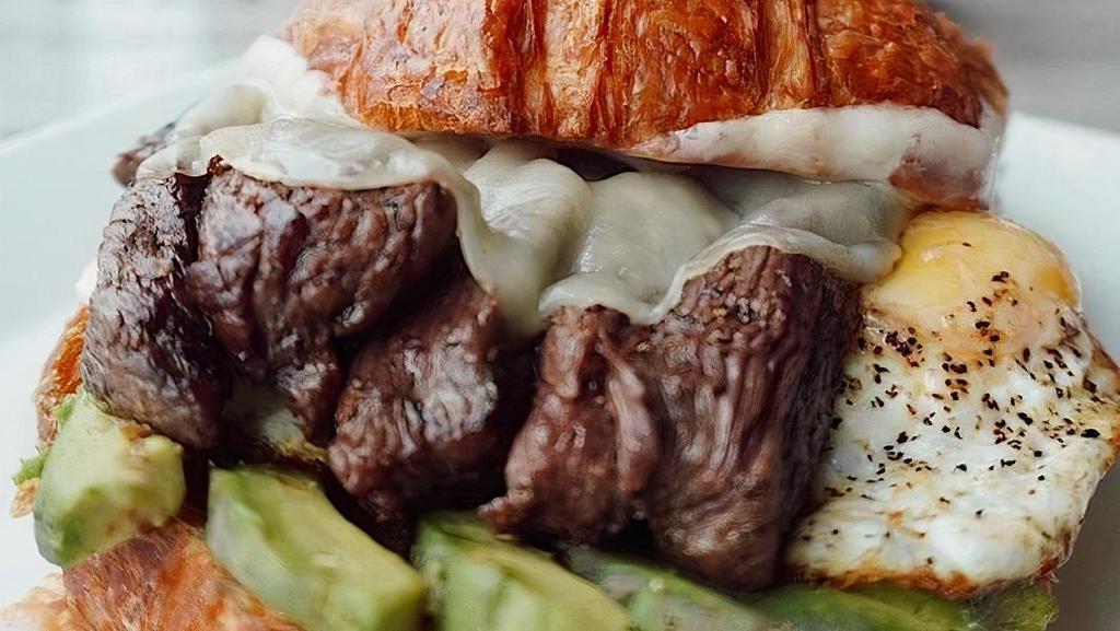 Croissant · butter croissant - skirt steak - provolone - (2) cage free fried eggs - avocado
