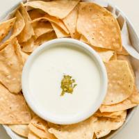 Queso Gringo · Vegetarian, gluten-free. Traditional Mexican cheese dip, pickled jalapenos.