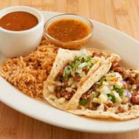 Puerco Al Pastor Tacos · Gluten-free. Marinated and sautéed pork, pineapple, chihuahua cheese, onion, cilantro, Chile...