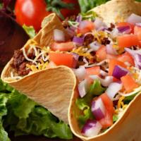 Loaded Taco Salad · Lettuce, sour cream, guacamole, Cheddar cheese, cucumbers, and carrots. Served with cilantro...