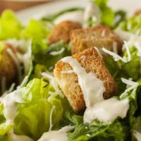 Caesar Salad · Romaine lettuce tossed with Caesar dressing, croutons, and parmesan cheese.