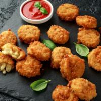 Spicy Ranch Mac N Cheese Bites · South beach famous mac and cheese bites made into small bite sized appetizers tossed in ranc...