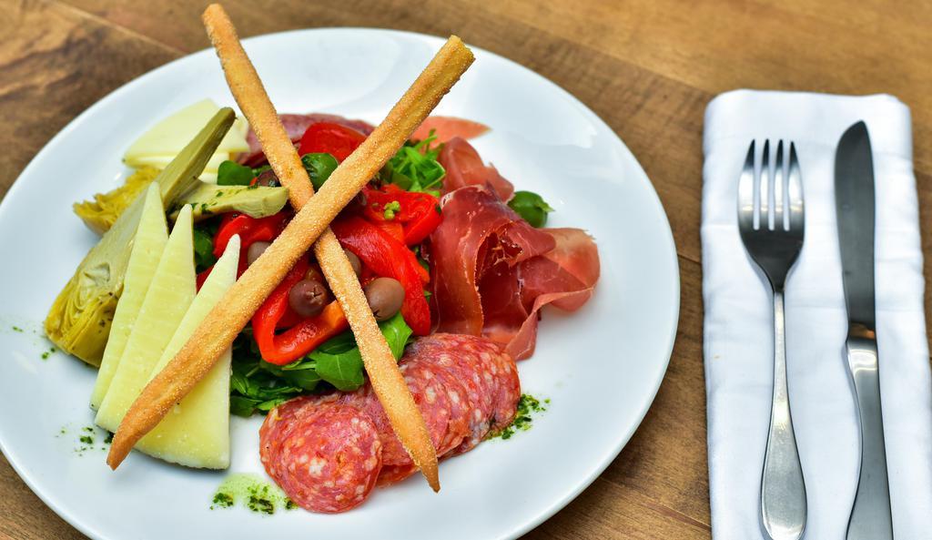 Antipasto · Generous portions of prosciutto di parma, genoa salami, soppressata, aged provolone, manchego cheese, roasted red peppers, and assorted italian olives drizzled with extra virgin olive oil and a touch of basil.
