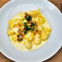 Fiocchi Gorgonzola · Purse shaped pasta stuffed with fresh pear and four kinds of cheese. Served with a walnut go...