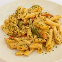 Spicy Rasta Pasta · Pasta cooked in a cream sauce with  Spicy jerk seasoning,  onions , carrots   and bell peppe...