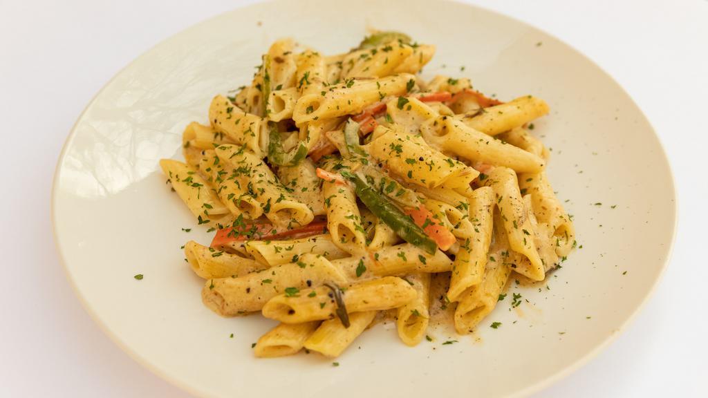 Spicy Rasta Pasta · Pasta cooked in a cream sauce with  Spicy jerk seasoning,  onions , carrots   and bell peppers , no meat