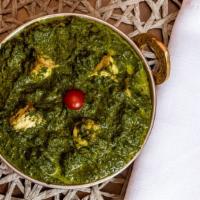 Palak Paneer · Cubes of homemade cottage cheese and spinach cooked with mild spices.