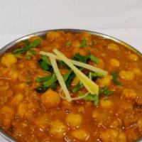 Chana Masala · Chickpeas curry cooked with Indian spices.